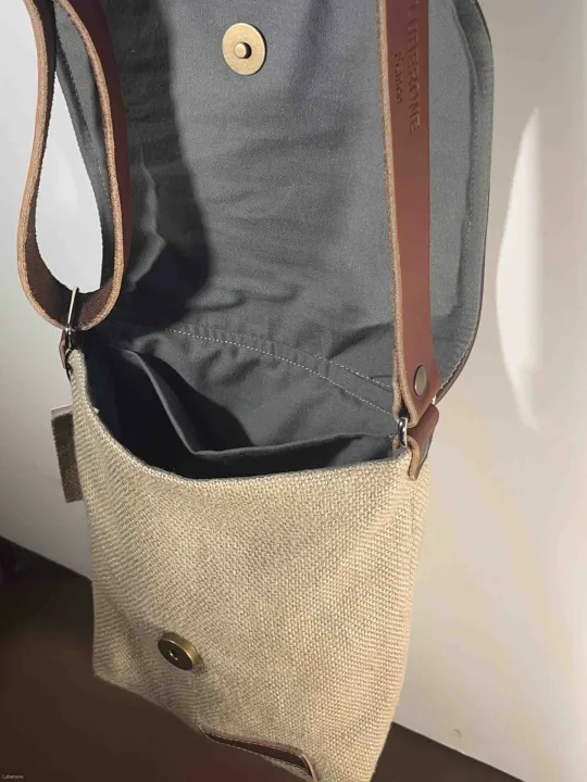 Linen silver grey shoulder bag with a leather flap inside