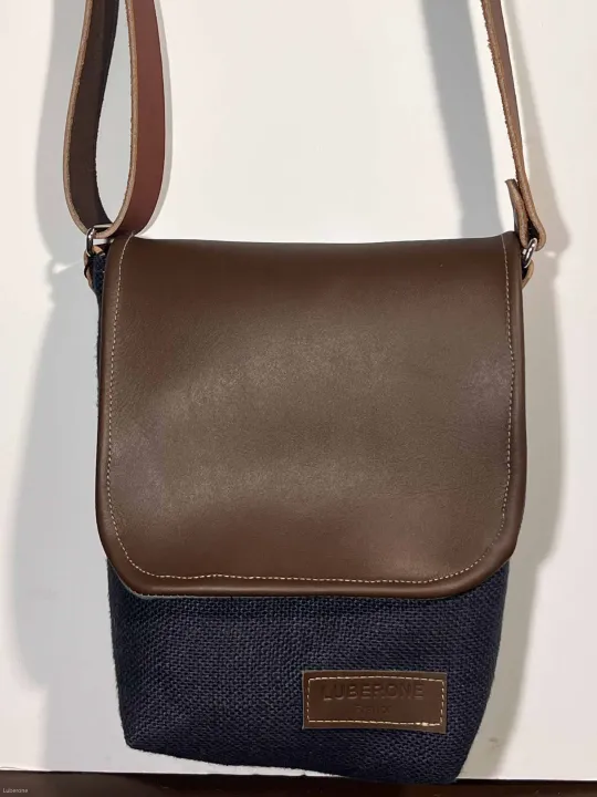 Linen navy shoulder bag with a leather flap face