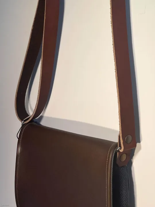 Linen navy shoulder bag with a leather flap strap