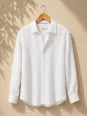 Men's white linen long sleeve shirt with collar on hanger