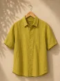Men's mustard yellow linen short sleeve shirt with collar on hanger