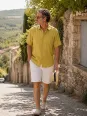 Man wearing a mustard yellow linen short sleeve shirt in the Luberon