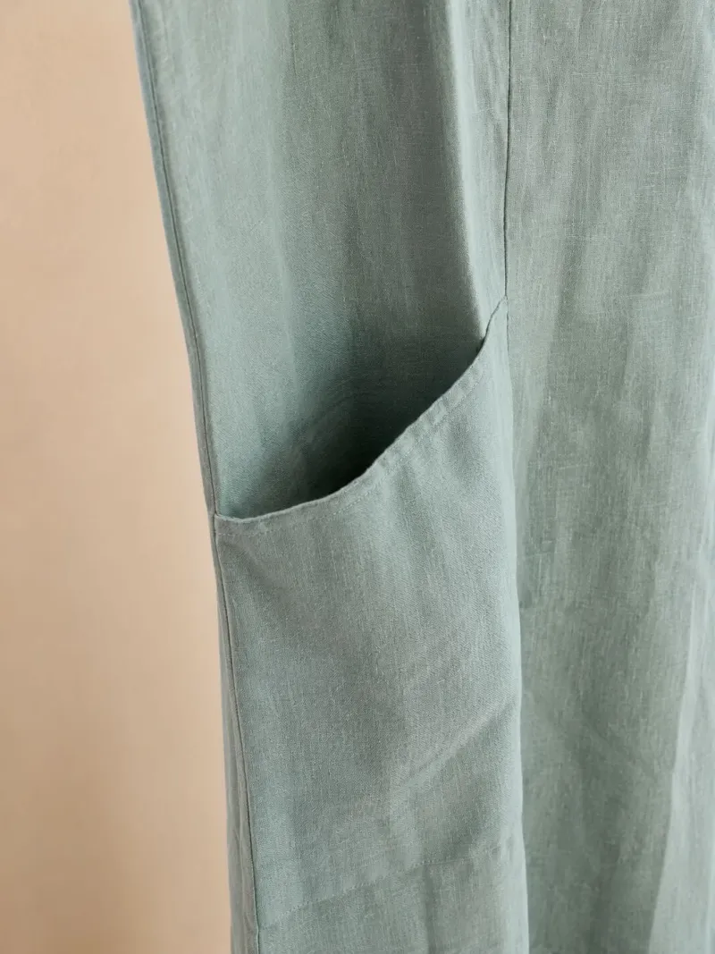 Close-up of the pocket on the women's green linen Roussillon dress