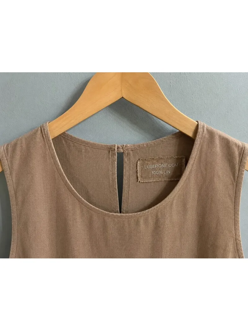 Close-up of the round neckline and label on the women's coffee linen Lourmarin dress