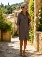 Woman wearing the taupe linen Ménerbes shirt dress in the Luberon, Provence, France
