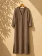 Women's long coffee linen dress with V-neck and long sleeves Rustrel on a wooden hanger