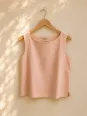 Women's salmon linen sleeveless top Lauris on a wooden hanger