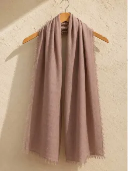 Brown 100% linen scarf hanging on a wooden hanger