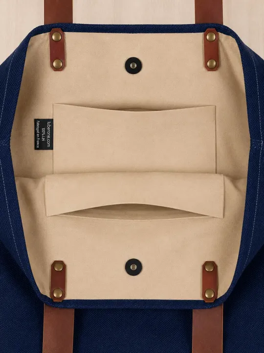 nterior of navy linen tote bag with magnetic closure and pockets