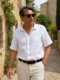 Man wearing a white short sleeve linen shirt Bonnieux