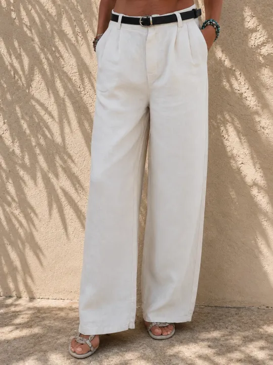 Front detail of women's sand pleated linen trousers