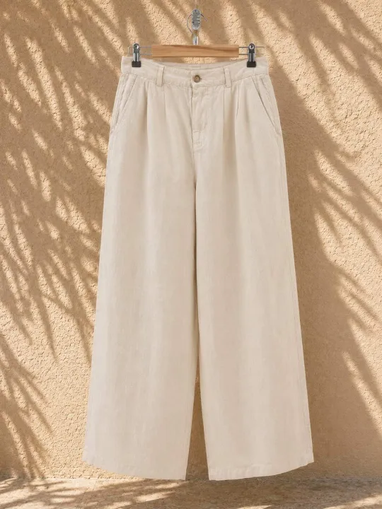 Women's sand pleated linen trousers on hanger