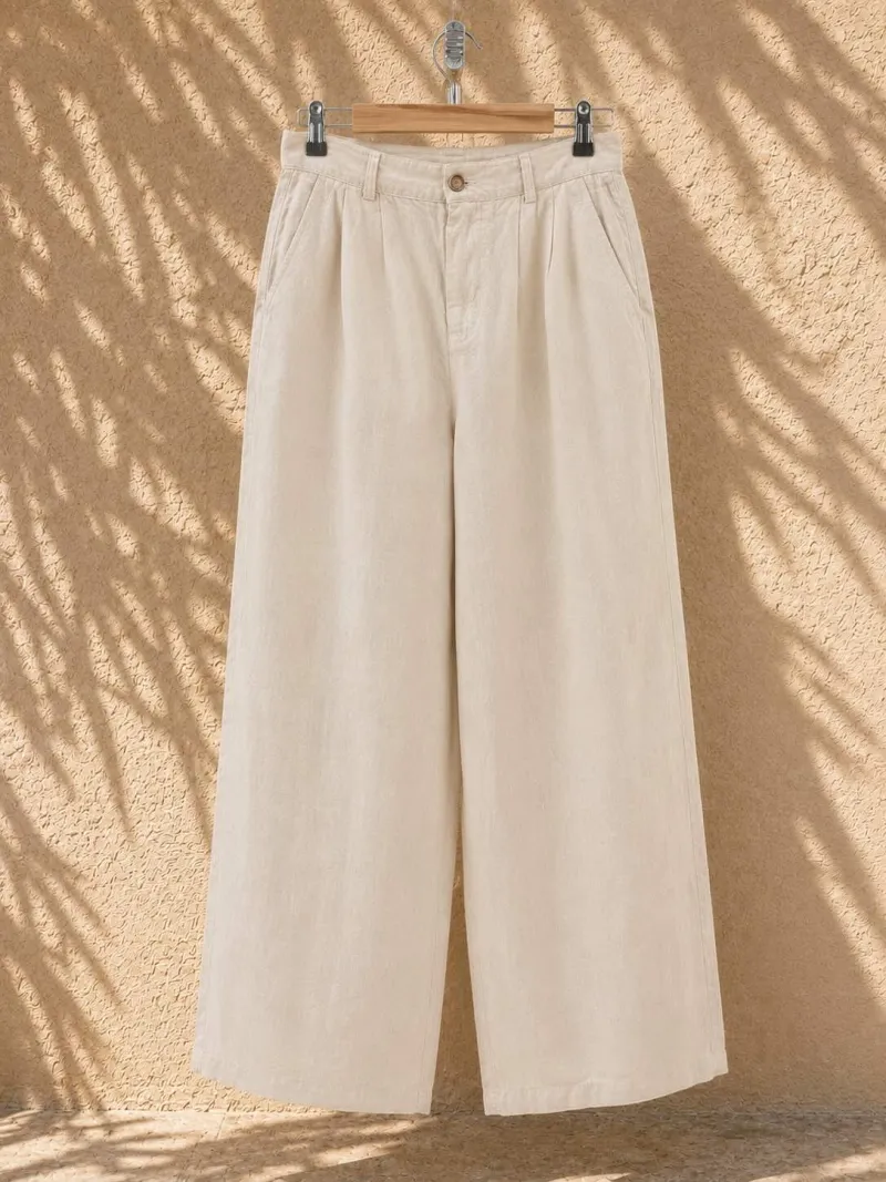 Women's sand pleated linen trousers on hanger