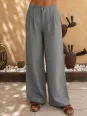 Women's pleated linen trousers in khaki – front detail