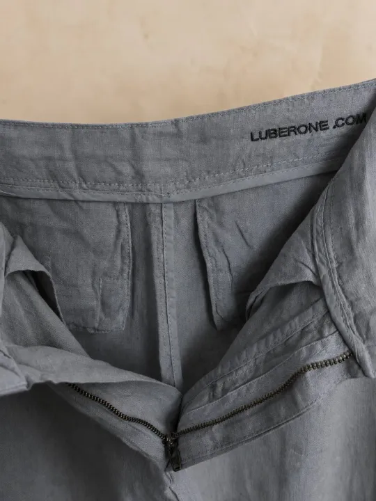 Inside finishing detail of women's pleated khaki linen trousers
