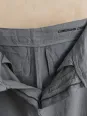 Inside finishing detail of women's pleated khaki linen trousers