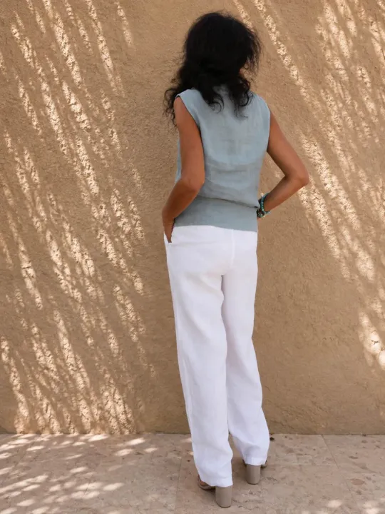 Women's white linen elastic waist trousers back view