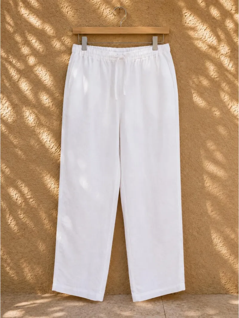 Women's white linen elastic waist trousers on hanger