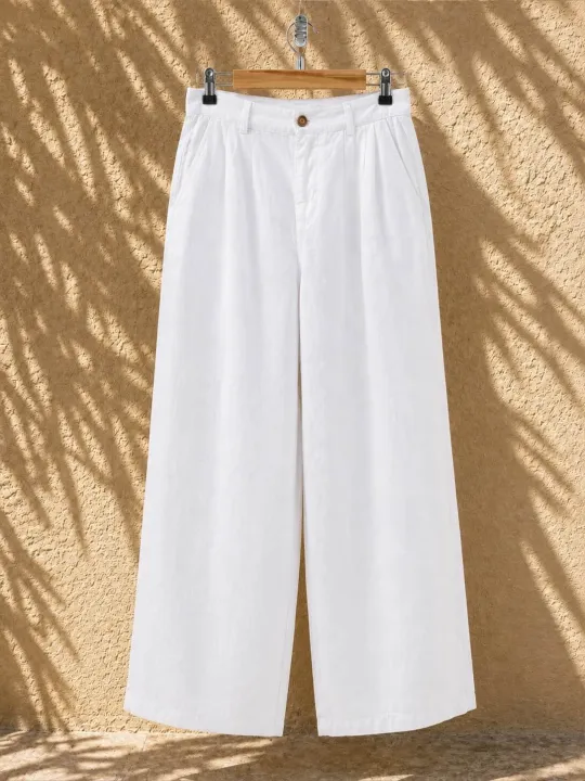 Pantalon en lin à pinces femme blanc sur cintre