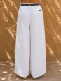 Back detail of women's white pleated linen trousers