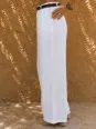 Side detail of women's white pleated linen trousers