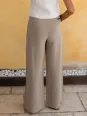 Détail de dos du pantalon en lin à pinces femme beige