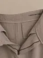 Inside view of women's beige pleated linen trousers