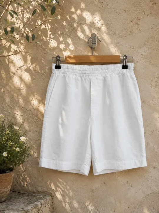 Women's white linen elastic waist bermuda shorts on hanger