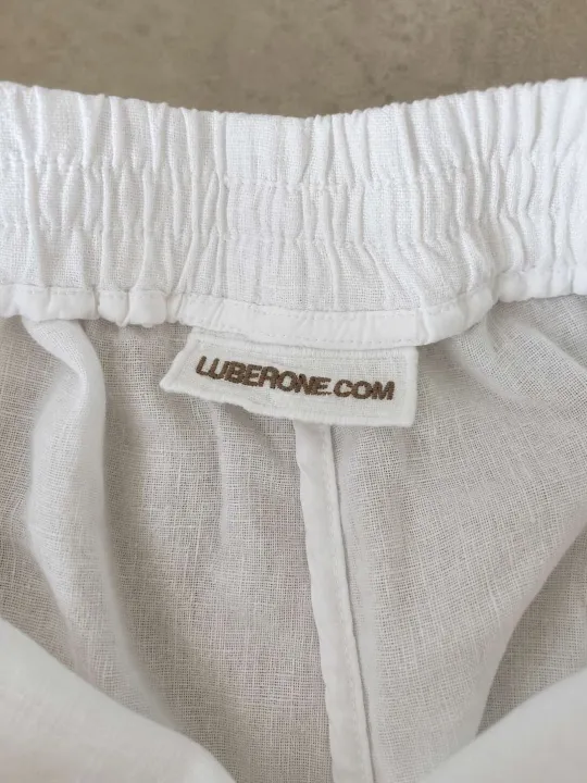 Inside of women's white linen elastic waist bermuda shorts with premium finishing