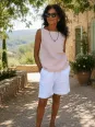 Women's white linen elastic waist bermuda shorts worn in the Luberon