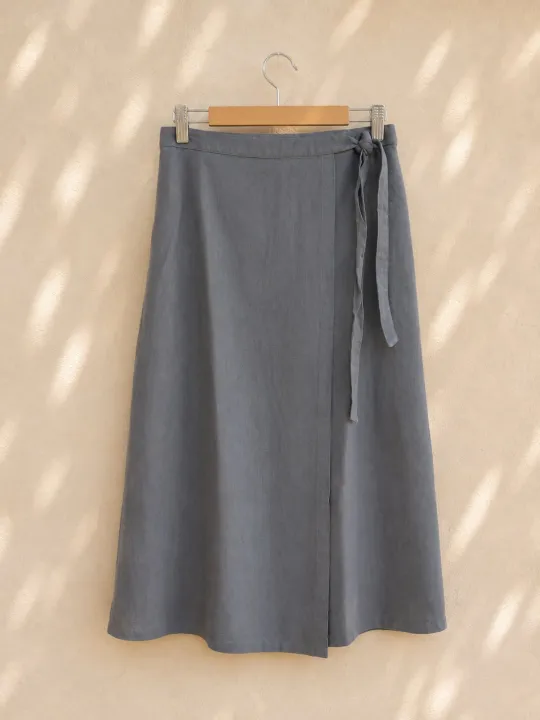 Women's taupe linen wrap skirt on wooden hanger