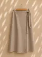 Women's beige linen wrap skirt on hanger