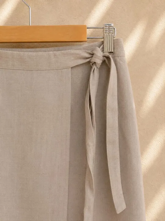 Tie fastening detail of the women's beige linen wrap skirt