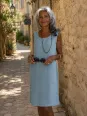Women's grey green linen dress, sleeveless Lourmarin worn in a Luberon village alley