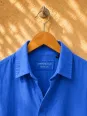 Collar and label of a royal blue linen shirt dress for women Ménerbes
