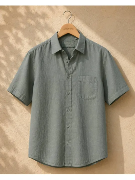 Sage green men's linen shirt with short sleeves Bonnieux on a wooden hanger