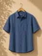 Navy men's linen shirt with short sleeves Bonnieux on a wooden hanger