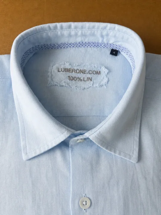 Collar and label of a sky blue men's linen shirt Bonnieux
