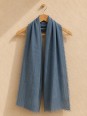 Green 100% linen scarf hanging on a wooden hanger