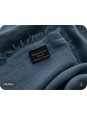 Close-up of the green linen fabric and the ‘Made in France’ label