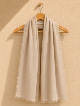 Sand 100% linen scarf hanging on a wooden hanger