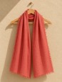 Ocher 100% linen scarf hanging on a wooden hanger