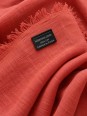Close-up of the ocher linen fabric and the ‘Made in France' label