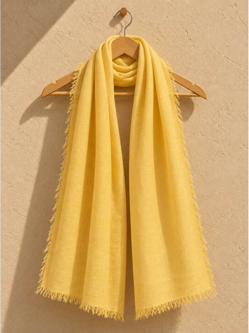 Saffron 100% linen scarf hanging on a wooden hanger
