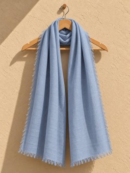 Blue 100% linen scarf hanging on a wooden hanger