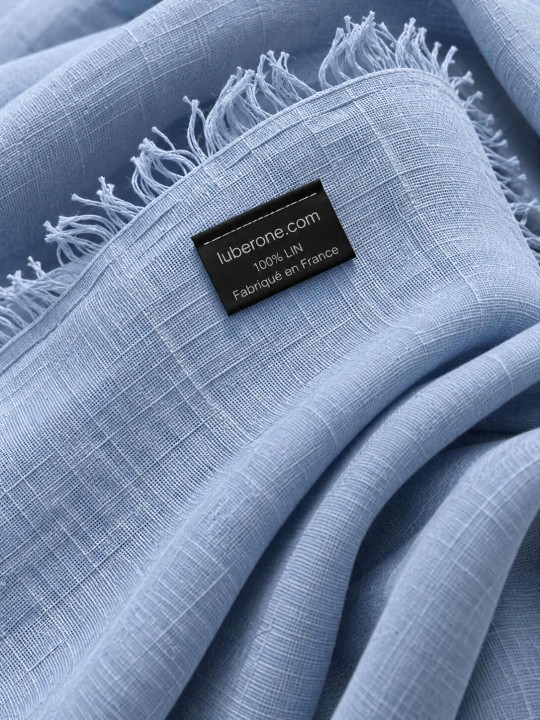 Close-up of the blue linen fabric and the ‘Made in France’ label