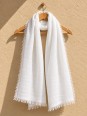 White 100% linen scarf hanging on a wooden hanger