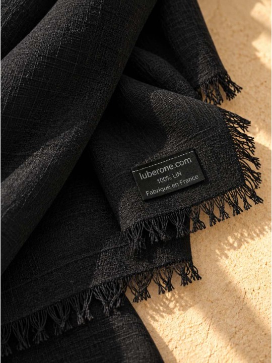 Close-up of the black linen fabric and the ‘Made in France’ label