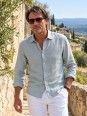 Man wearing a green-grey long-sleeved linen shirt in the Luberon